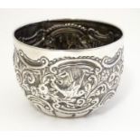A Victorian silver sugar bowl with embossed decoration, hallmarked London 1877 maker Goldsmiths &