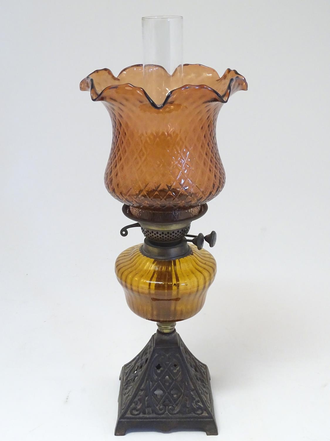 A late 19thC Duplex oil lamp, with bronzed glass shade and reservoir, standing on a cast iron base - Image 7 of 24