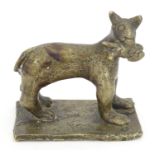 An 18th / 19th century naive bronze model of a standing cat with a fish, on a rectangular base.