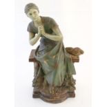 A 20thC French terracotta sculpture of a seated woman on a bench after Luca Madrassi (1849-1919),