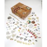A vintage pigskin jewellery case containing assorted jewellery including bracelets, brooches,