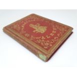 A Victorian memento album with tooled red leather cover, containing hand written prayers,