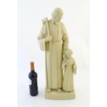 A 20thC Continental plaster sculpture depicting Saint Joseph with Jesus Christ as a child, Joseph