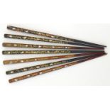 A quantity of Oriental lacquered hair sticks / pins of tapering form with abalone inlay. Approx. 8