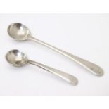 Two silver Old English pattern salt spoons, one hallmarked London 1785, the other Sheffield 1961.