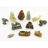 A quantity of assorted Oriental soapstone items comprising a foo dog / guardian lion, a child riding