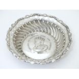 An Edward VII silver coronation souvenir dish with embossed decoration, titled Edward VII crowned
