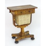 A Regency burr elm sewing table with a rectangular top above a single short drawer and deep fabric