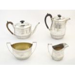 A Victorian Scottish 4-piece silver teaset comprising teapot, hot water pot, milk jug and sugar.