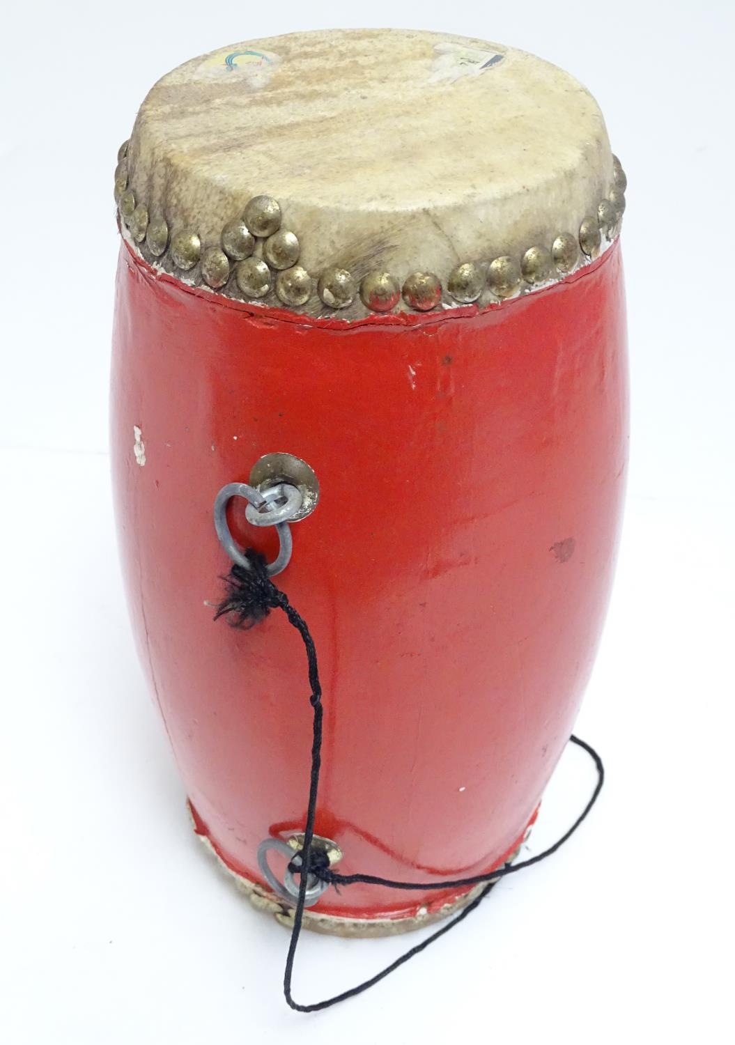 Musical Instrument: a mid 20thC Dholak drum, of elliptical form with dual skins, strap loops, in red - Image 6 of 6