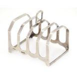 A silver five bar toast rack, hallmarked Birmingham 1940, maker F H Adams & Co. Approx. 3" long x 3"