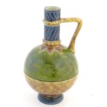 A French Sarreguemines Pottery stoneware single handle majolica vase. Marked under. Approx. 11" high