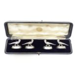 A cased set of silver menu holders / table place card holders modelled as pheasants / birds,