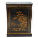 A late 19thC ebonised pier cabinet with a crossbanded frame and marquetry inlaid door and a