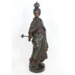 A large bronze depicting a female monarch with crown and sceptre, possibly a young Queen Victoria.