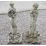 Garden & Architectural, Salvage: a pair of 20thC reconstituted stone statues formed as cherubs