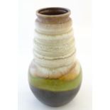 A large West German vase with a bulbous body and ribbed tapering neck. Marked under 269-40.