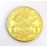 Coin: An American gold 1896 twenty / 20 dollar coin. Approx. 1 3/8" Please Note - we do not make