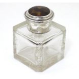 A cut glass inkwell with silver mounts and tortoise shell lid, hallmarked Birmingham 1924, maker