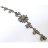 A vintage silver plate bracelet set with pyrite stones. Please Note - we do not make reference to