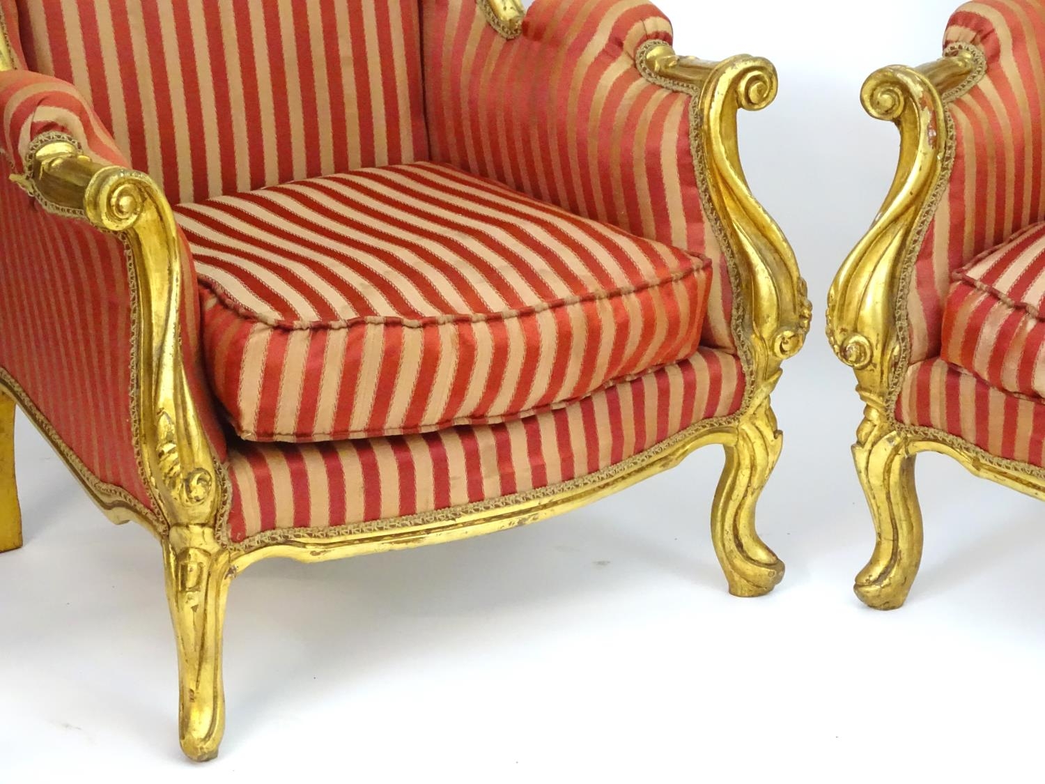 A pair of mid 20thC large gilt wingback armchairs, having moulded frames with floral decoration, - Image 6 of 7