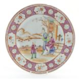 A Chinese famille rose plate depicting figures on a garden terrace with a mountainous landscape
