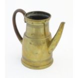 An early 20thC Continental brass jug, with curved hardwood handle, stamped underside ' 1L CDE ' ,