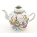 A Chinese famille rose teapot depicting scholars with attendants on a terrace with a mountainous