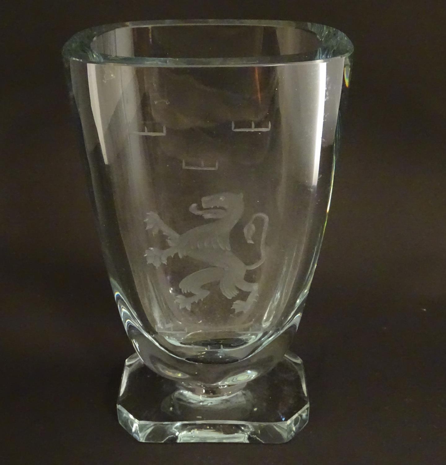 A Scandinavian glass vase with engraved rampant lion decoration. In the manner of Elis Bergh for