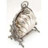 A silver plate biscuit box of shell formed with foliate frame and laurel chaplet handles. Maker