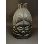 Ethnographic / Native / Tribal: A late 19th / early 20thC carved wooden Mende bundu helmet mask of