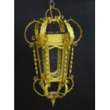 A gilt metal pendant lantern, with six panels, approx. 27" tall