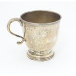 A silver christening mug with hammered decoration. Hallmarked London 1931 maker Wakely and Wheeler 3