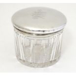 A cut glass dressing table pot with silver lid, hallmarked Birmingham 1930, 3 1/2" diameter x 3"