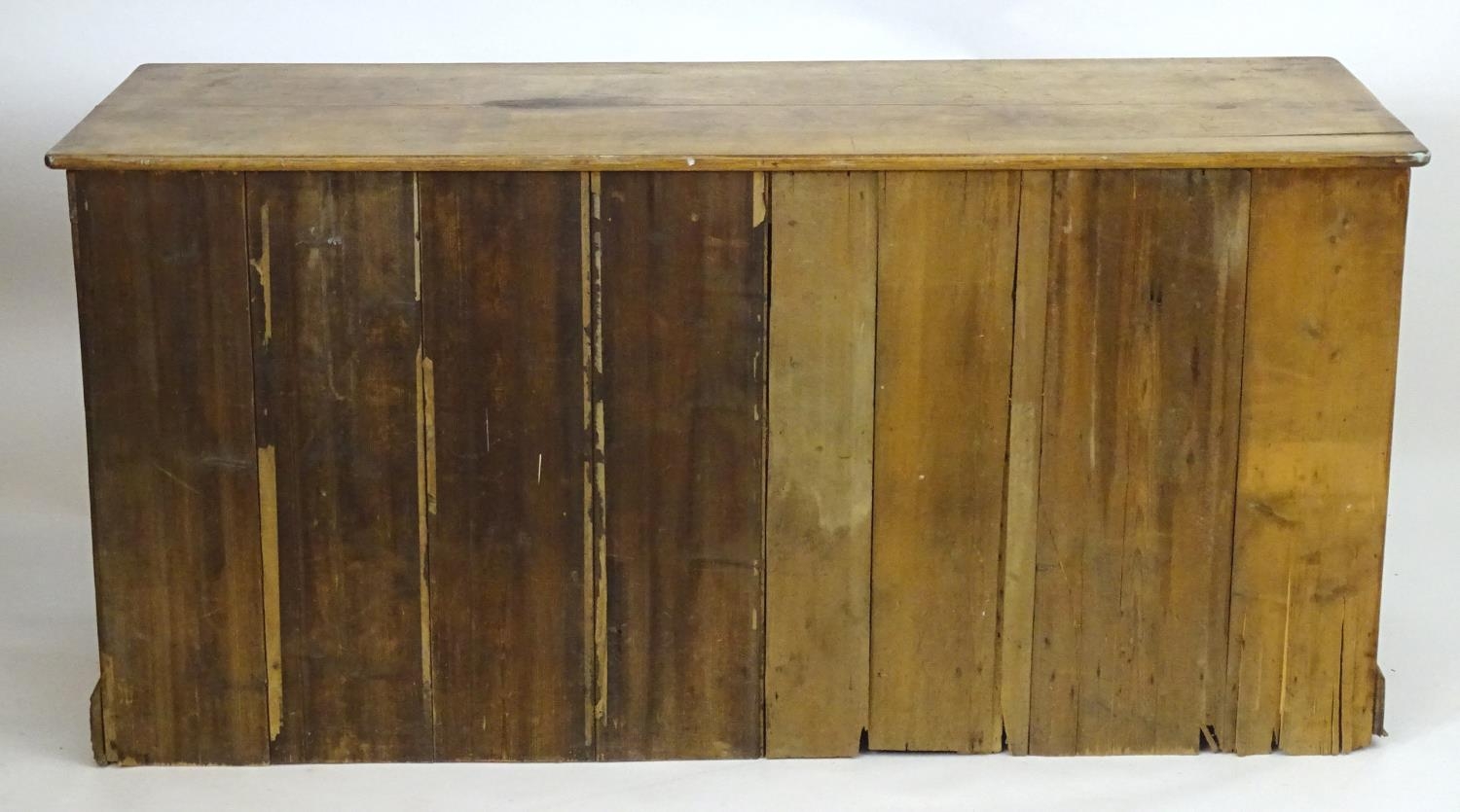 A late 19thC pine dresser base with a moulded rectangular top above a single cupboard, seven short - Image 5 of 7