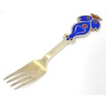 A Danish sterling silver gilt and enamel 1974 Christmas fork with "Bluebird" design. Maker A.