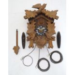 A 20thC Cuckoo clock marked West Germany, G.M and stamped Regula. Approx 11" high Please Note - we