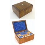 A Victorian walnut cushion top work box with inlaid banding and hexagonal detail to escutcheon and