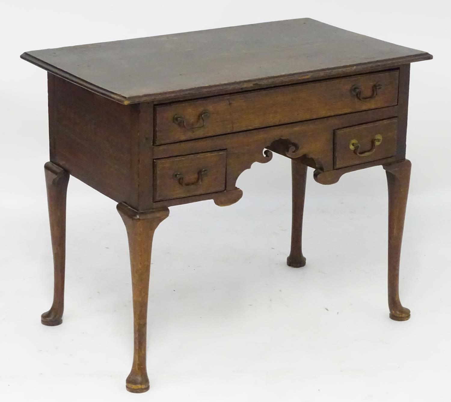 A mid 18thc oak lowboy with a moulded rectangular top above a single long and two short drawers with - Image 5 of 5