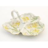 A three sectional leaf shaped plate with central handle and daffodil detail. Marked under. Approx.