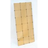 Vintage retro, mid century: a wall hanging mirror constructed from eighteen peach glass tiles, 47