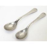 A pair of silver Old English pattern mustard spoons, hallmarked Birmingham 1915, maker E S