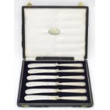A cased set of six silver handled tea / butter knives, hallmarked Sheffield 1923, maker William