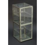A late 20thC shop glazed display tower case, consisting of two compartments with provision for