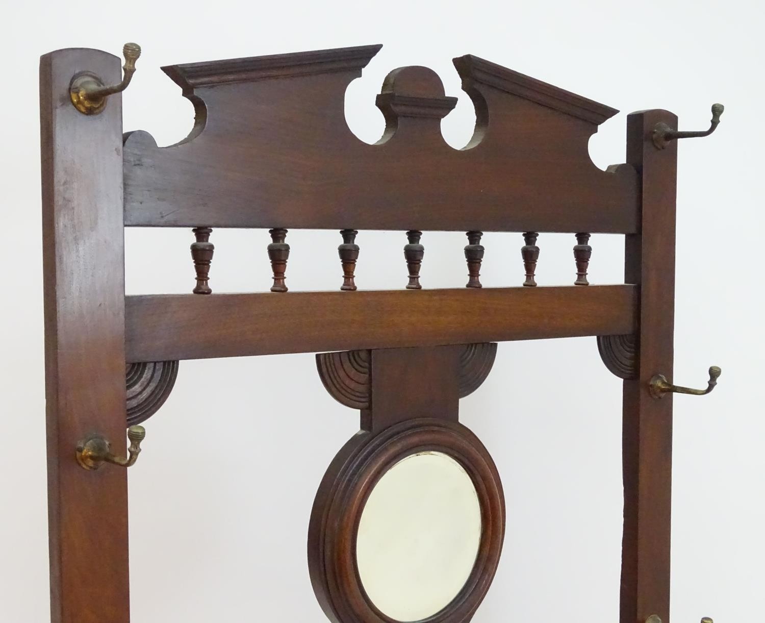 A late 19thC / early 20thC mahogany hall stand with a moulded cornice above turned finial supports - Image 3 of 7