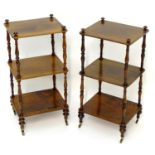 A pair of regency rosewood whatnots with turned finials to the tops and three tiers united by turned