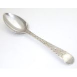 A George III silver teaspoon with bright cut, hallmarked London 1787, maker Hester Bateman.