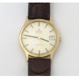 A mid 20thC Omega Geneva automatic chronometer wrist watch with a 9ct gold case. The movement