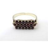 A Continental .900 silver gilt ring set with garnets. Ring size approx Size P Please Note - we do