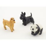 Three Beswick animals comprising a Scottie dog, model no. 2037, Standing Cocker Spaniel, model no.